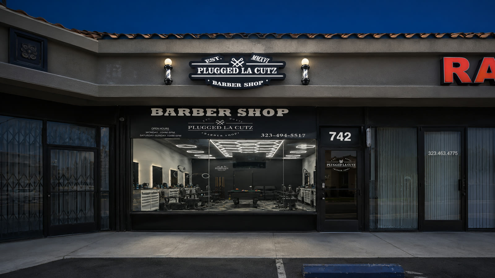 Street-level arrival at the Plugged LA Cutz storefront, suite 742 beside the glass door.